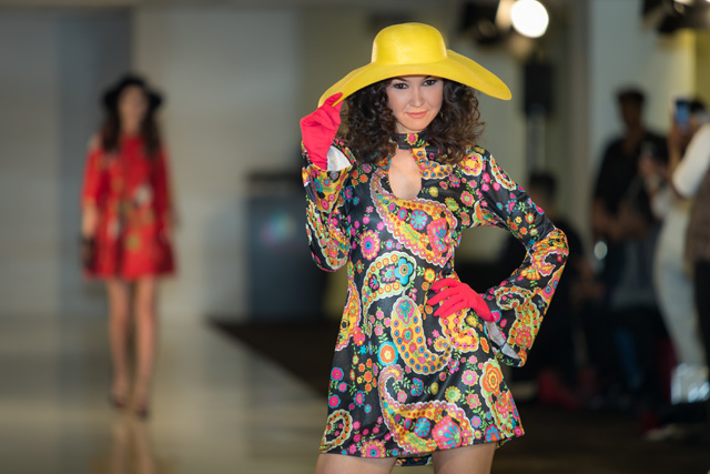 fashion model on runway in yellow hat