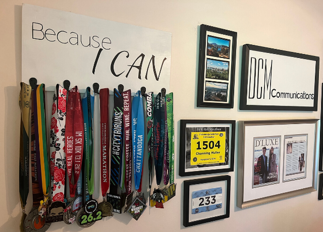gallery wall with a variety of race medals