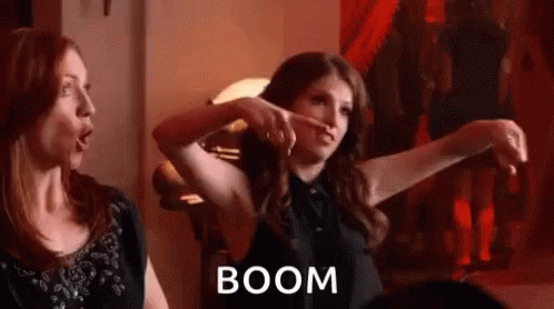 gif of woman holding hands up and the word BOOM across the screen