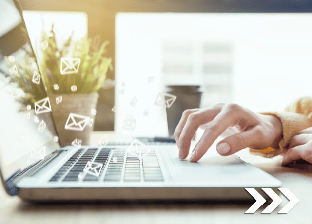 email icons floating from laptop, hands on keyboard relating to email marketing mistakes