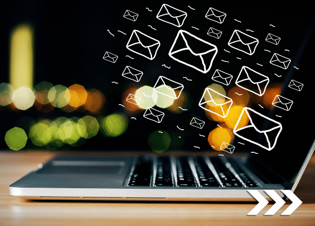 email icons floating out of laptop relating to growing email marketing list