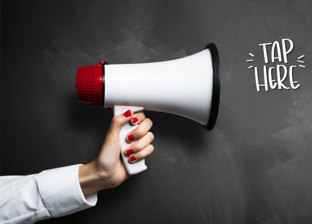hand holding megaphone relating to deciding whether to speak out about politics in your business