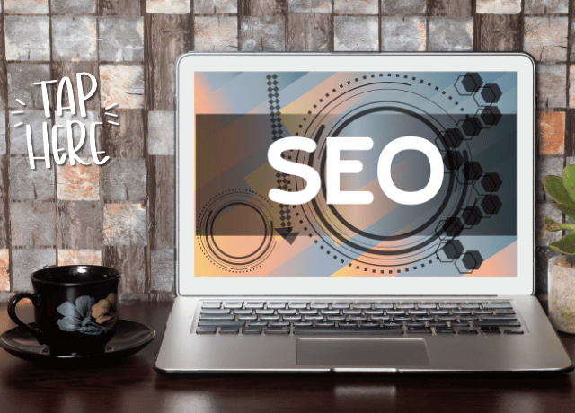 laptop sitting on counter with SEO text relating to how to improve seo