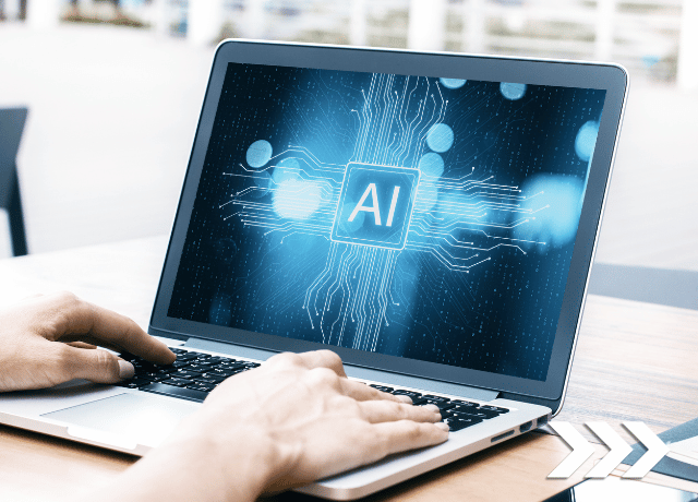 hands on laptop keyboard with AI text and graphics on the screen relating to using AI for copywriting