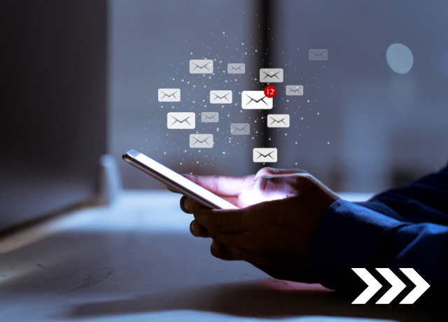 hands holding a phone with email graphics popping up above