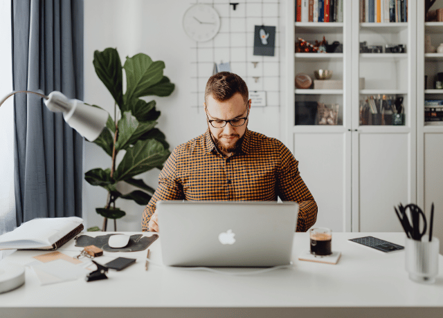man working at computer relating to brand positioning